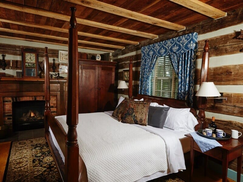 Log cabin bedroom with fireplace